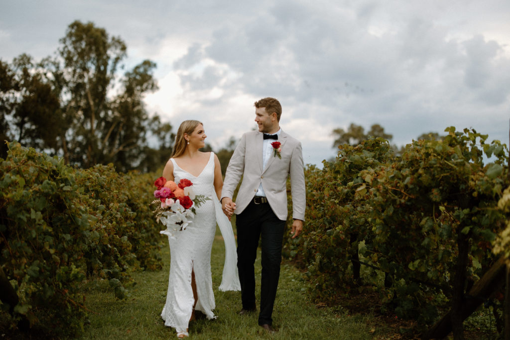 Bride and groom among vineyards at Lazy River Estate, Dubbo